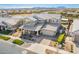 Aerial view of home in a neighborhood, featuring landscaping, neutral colors, and mountain views at 10635 E Tesla Ave, Mesa, AZ 85212