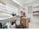 Messy walk-in closet with built-in shelving, a variety of items for storage or organization at 10635 E Tesla Ave, Mesa, AZ 85212