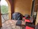 Cozy balcony featuring comfortable seating and a covered grill for outdoor cooking and relaxation at 10655 N 9Th St # 204, Phoenix, AZ 85020