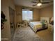 Bright bedroom featuring a ceiling fan, ample closet space and a large window for natural light at 10655 N 9Th St # 204, Phoenix, AZ 85020