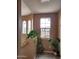 Hallway with natural light, plants, and decorative bicycle wine rack at 10655 N 9Th St # 204, Phoenix, AZ 85020