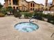 Inviting community hot tub surrounded by well-maintained landscaping and residential buildings at 10655 N 9Th St # 204, Phoenix, AZ 85020