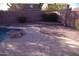 Backyard featuring a pool, patio, lush greenery, and a peaceful setting perfect for outdoor relaxation at 1083 E Jade Dr, Chandler, AZ 85286