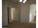 Bedroom showing archway and doors leading to other rooms with neutral carpet and ceiling fan at 1083 E Jade Dr, Chandler, AZ 85286