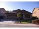 Charming single-story home featuring a tile roof, desert landscaping, and a two-car garage at 1083 E Jade Dr, Chandler, AZ 85286