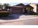 Cozy single-story house showcasing a tile roof, low maintenance desert landscaping, and a two-car garage at 1083 E Jade Dr, Chandler, AZ 85286