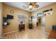 Inviting bedroom with warm paint, wood laminate flooring, and a relaxing ceiling fan at 11122 N 165Th Ave, Surprise, AZ 85388