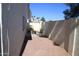 Private backyard features a neutral gravel bed, mature landscaping, and block wall for complete privacy at 1133 N Florence Dr, Chandler, AZ 85226