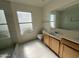 Bright bathroom featuring double sink vanity and tile flooring at 1133 N Florence Dr, Chandler, AZ 85226