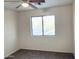 Simple bedroom with carpet, ceiling fan and standard window at 1133 N Florence Dr, Chandler, AZ 85226