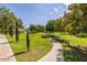 Scenic view of the neighborhood park with a picnic pavilion and walking path surrounded by trees at 1133 N Florence Dr, Chandler, AZ 85226