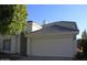 Charming single-story home with a well-maintained two car garage, neutral colors, and gray tile roof at 1133 N Florence Dr, Chandler, AZ 85226