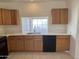 Well-lit kitchen with granite counters and modern appliances, with bright natural light at 1133 N Florence Dr, Chandler, AZ 85226