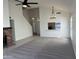 Open living room featuring vaulted ceilings, ceiling fan, and a view to the kitchen over the breakfast bar at 1133 N Florence Dr, Chandler, AZ 85226