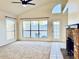 Bright living room featuring large windows, a fireplace, and carpet floors at 1133 N Florence Dr, Chandler, AZ 85226