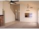 Inviting living room with a vaulted ceiling, ceiling fan, and a breakfast bar connected to the kitchen at 1133 N Florence Dr, Chandler, AZ 85226