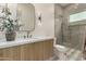 Bathroom features marble countertops, wooden cabinets, and walk-in shower at 12240 N 62Nd Pl, Scottsdale, AZ 85254