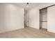 Bedroom featuring wood floors and an open closet at 12240 N 62Nd Pl, Scottsdale, AZ 85254