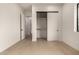 Bedroom featuring wood floors, walk-in closet, and neutral paint at 12240 N 62Nd Pl, Scottsdale, AZ 85254