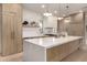 Bright and airy kitchen featuring a quartz island, stainless steel appliances, and custom cabinets at 12240 N 62Nd Pl, Scottsdale, AZ 85254