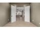 Living room with white walls and wood flooring, showcasing the open floor plan at 12240 N 62Nd Pl, Scottsdale, AZ 85254