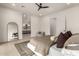 An airy main bedroom featuring a ceiling fan, a modern ensuite bathroom, and bright natural light at 12240 N 62Nd Pl, Scottsdale, AZ 85254