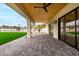 Beautiful covered patio with wood ceilings, tile floors and access to the backyard at 12240 N 62Nd Pl, Scottsdale, AZ 85254