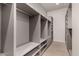 Large walk-in closet with custom shelving and ample storage space, with neutral grey paint throughout at 12240 N 62Nd Pl, Scottsdale, AZ 85254