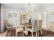 Traditional dining room featuring a wood table, patterned rug and china cabinet, perfect for hosting dinner parties at 12810 W Ashwood Dr, Sun City West, AZ 85375