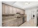 Updated kitchen featuring stainless steel appliances, granite countertops, and ample cabinet space at 12810 W Ashwood Dr, Sun City West, AZ 85375