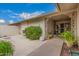 Inviting covered patio featuring decorative wrought iron details and room for outdoor enjoyment at 12810 W Ashwood Dr, Sun City West, AZ 85375