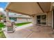 Covered patio perfect for outdoor dining, featuring a stainless steel BBQ grill at 12810 W Ashwood Dr, Sun City West, AZ 85375