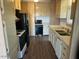 View of a kitchen with white cabinets, laminate countertops, and standard appliances at 13229 N 19Th Pl, Phoenix, AZ 85022