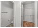 View of a water closet area and walk-in closet featuring wire shelving at 14314 W Pecos Ln, Sun City West, AZ 85375