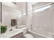 Tiled bathroom features a shower/tub combo and a sink with countertop at 14314 W Pecos Ln, Sun City West, AZ 85375