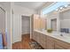 Bathroom with a double sink vanity, tile floors, and walk-in closet at 14314 W Pecos Ln, Sun City West, AZ 85375