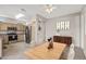 Kitchen and dining area with stainless steel appliances and wood cabinetry at 14314 W Pecos Ln, Sun City West, AZ 85375