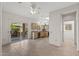 Dining area adjacent to kitchen featuring tiled floors and sliding glass doors to the patio at 14314 W Pecos Ln, Sun City West, AZ 85375