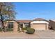 Charming home with desert landscaping, complemented by a tile roof and a convenient two-car garage at 14314 W Pecos Ln, Sun City West, AZ 85375