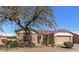 Charming single-story home with desert landscaping and a tile roof at 14314 W Pecos Ln, Sun City West, AZ 85375