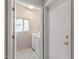 Well-lit laundry room with window and modern washer and dryer units at 14314 W Pecos Ln, Sun City West, AZ 85375