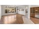 Bright living room with hardwood floors, a ceiling fan, and sliding glass doors to the backyard at 14314 W Pecos Ln, Sun City West, AZ 85375