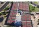 Aerial view of multiple pickleball courts surrounded by landscaping and seating areas at 14314 W Pecos Ln, Sun City West, AZ 85375