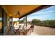 Covered back patio with a ceiling fan, perfect for enjoying outdoor meals and relaxing at 14925 E Morning Vista Ln, Scottsdale, AZ 85262