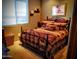 Comfortable bedroom featuring a metal bed frame and matching decorative throw pillows at 14925 E Morning Vista Ln, Scottsdale, AZ 85262