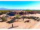 Home exterior featuring desert landscaping and a private entrance gate at 14925 E Morning Vista Ln, Scottsdale, AZ 85262