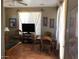 A traditional living room with a dining table, a large window and tile flooring at 14925 E Morning Vista Ln, Scottsdale, AZ 85262