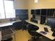 Home office featuring multiple desks with storage and rolling chairs at 14925 E Morning Vista Ln, Scottsdale, AZ 85262