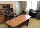 Spacious office featuring a desk with storage and large executive chair at 14925 E Morning Vista Ln, Scottsdale, AZ 85262