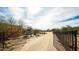 Gated property entrance with a long driveway surrounded by lush desert foliage at 14925 E Morning Vista Ln, Scottsdale, AZ 85262